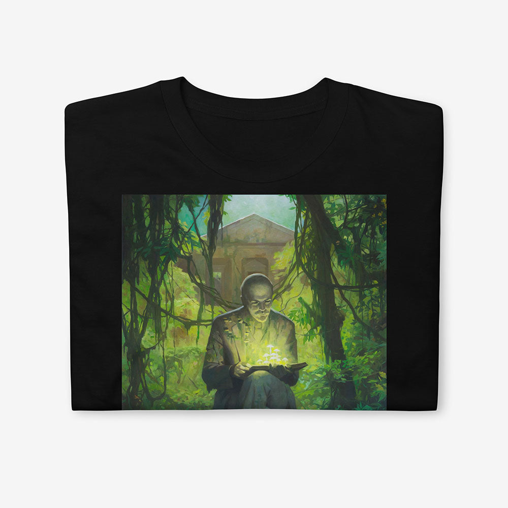T-shirt with surreal image of Lenin statue in forest reading a book with glowing green mushrooms growing from it and on him