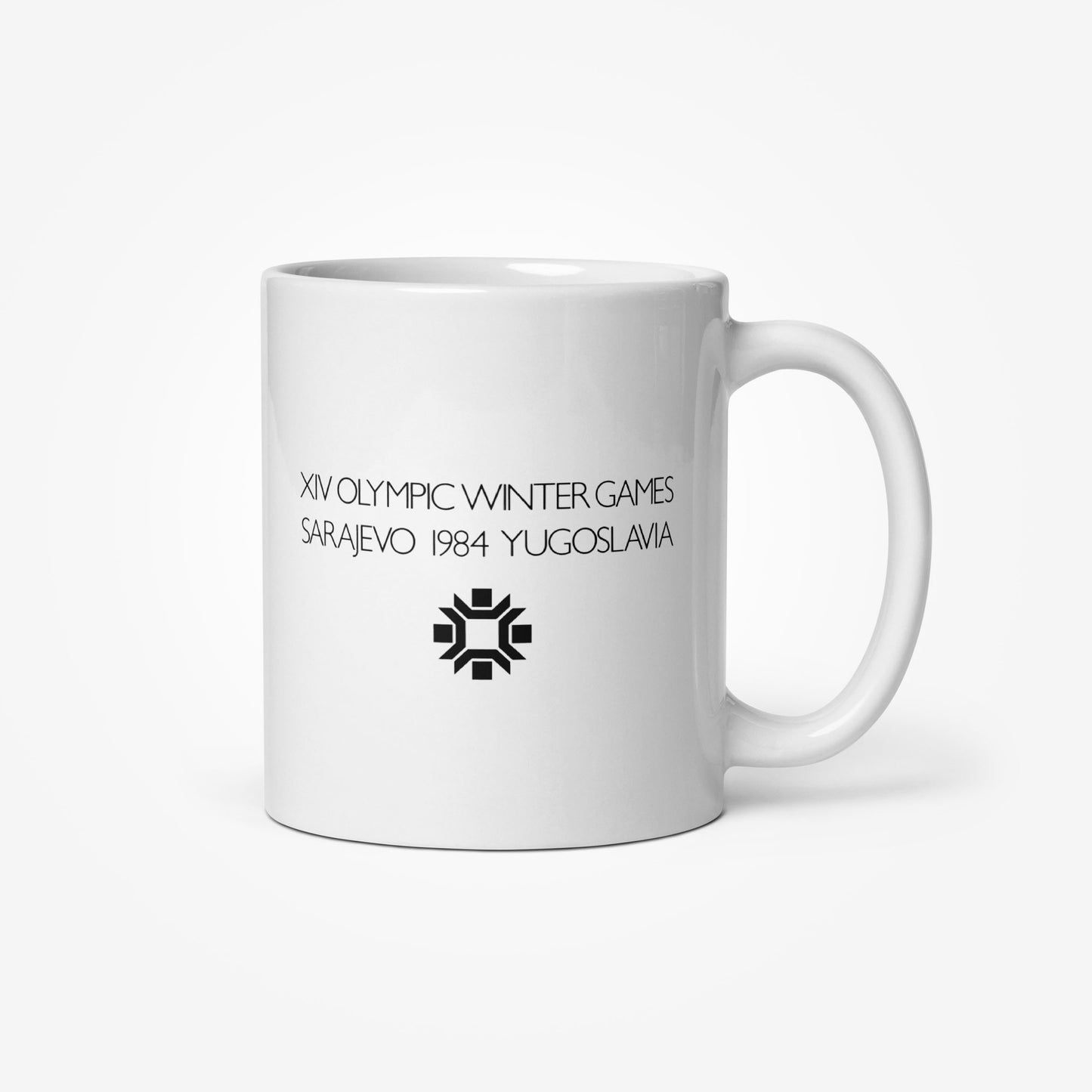 Mug with Milton Glaser’s Sarajevo 1984 Olympic artwork featuring Yugoslav column and Olympic rings