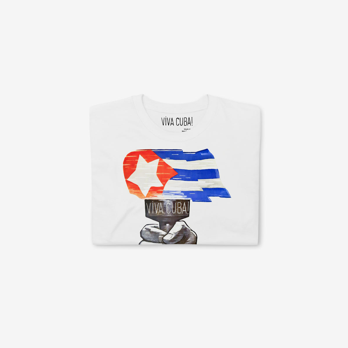 Vintage white unisex T-shirt featuring large print with a hand holding a torch with flames in shape of a Cuban flag. Original Soviet Cold-War era solidarity propaganda. Folded. www.artsoviet.com