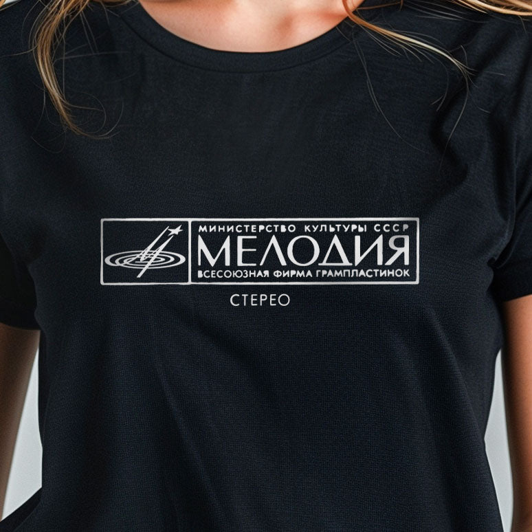 Young girl wearing unisex black Soviet music Melodiya Records logo T-shirt – Soviet era music culture and state record label heritage.