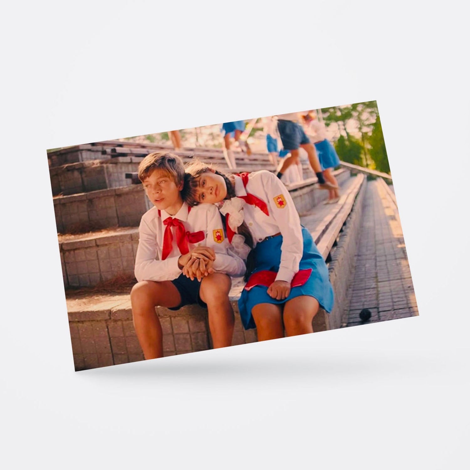 Vintage Soviet postcard featuring young Pioneer boy and girl sitting together in love