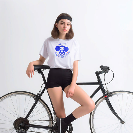Young attractive teenage girl in short shorts wearing iconic Cheburashka with birthday cake unisex white T-shirt