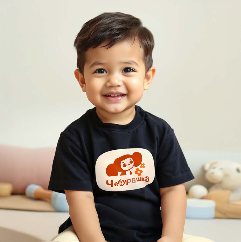 Cute baby boy wearing Cheburashka baby T-shirt featuring the beloved Soviet cartoon character with a flowers. Iconic USSR animation.