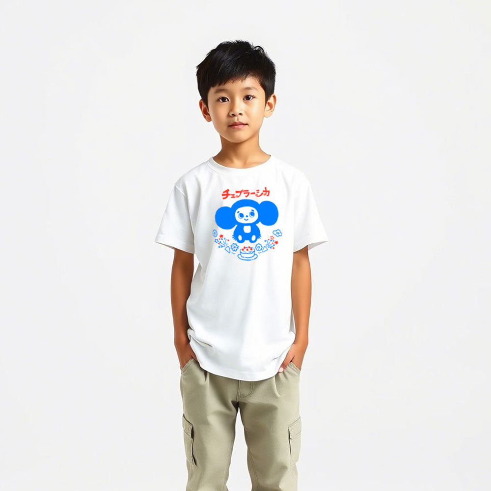 Cute japanese youth boy wearing unisex Cheburashka Birthday Tee チェブラーシカ in Japanese with a birthday cake