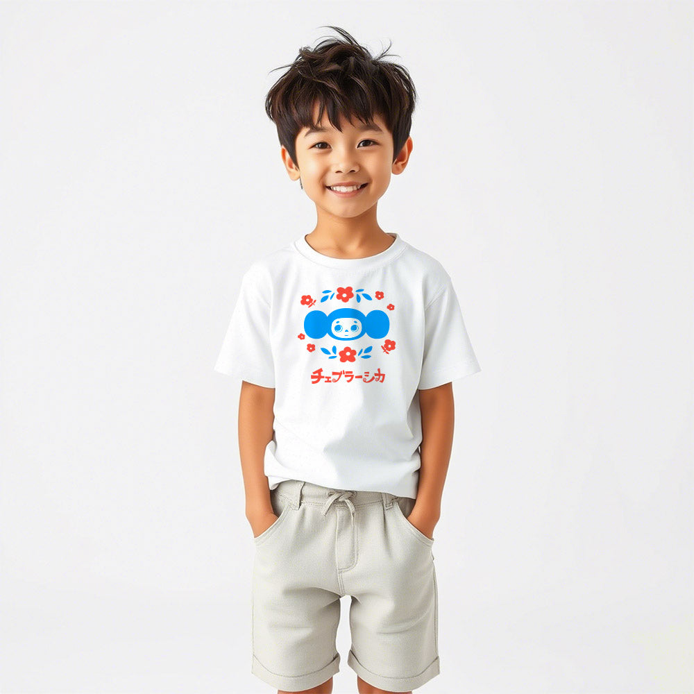 Cute japanese boy wearing youth T-shirt with Soviet cartoon character Cheburashka holding a bouquet of flowers, with チェブラーシカ text in Japanese, on a white background