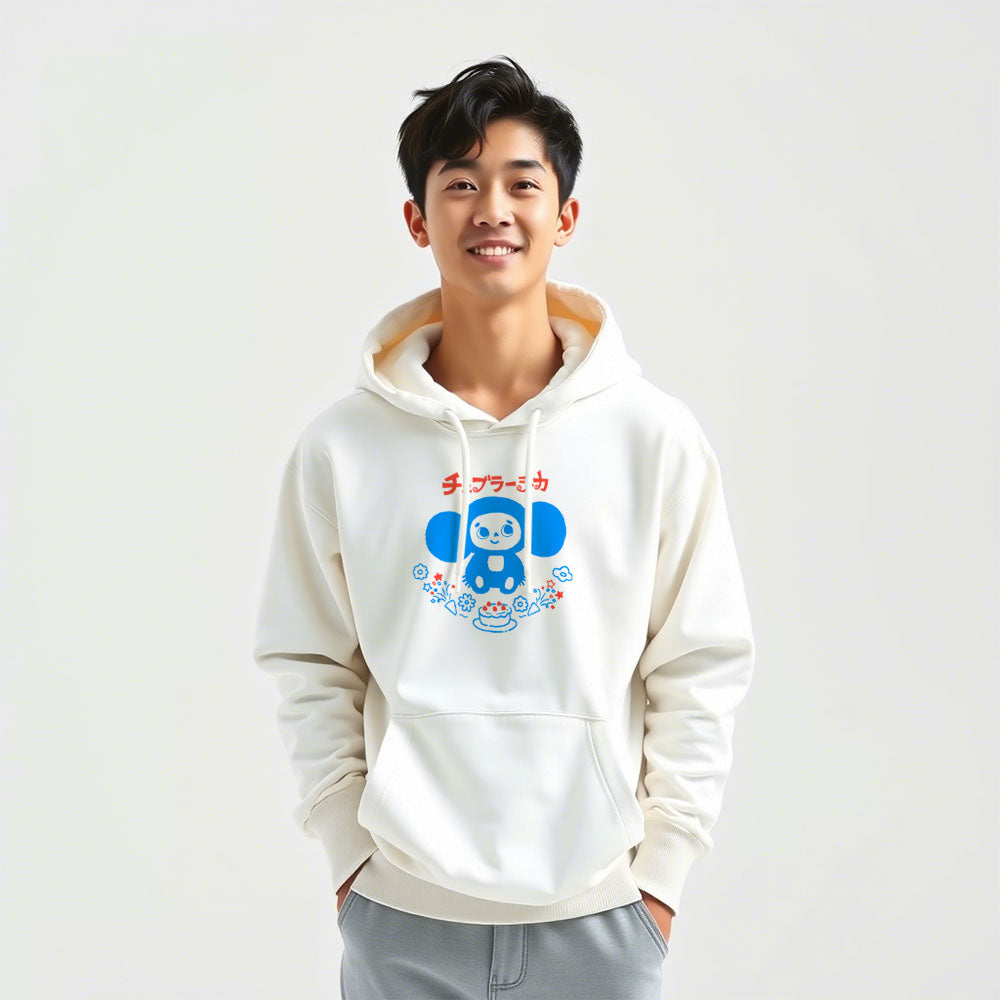 Cute japanese boy wearing unisex hoodie with Cheburashka holding a birthday cake and Japanese チェブラーシカ logo, nostalgic Soviet design