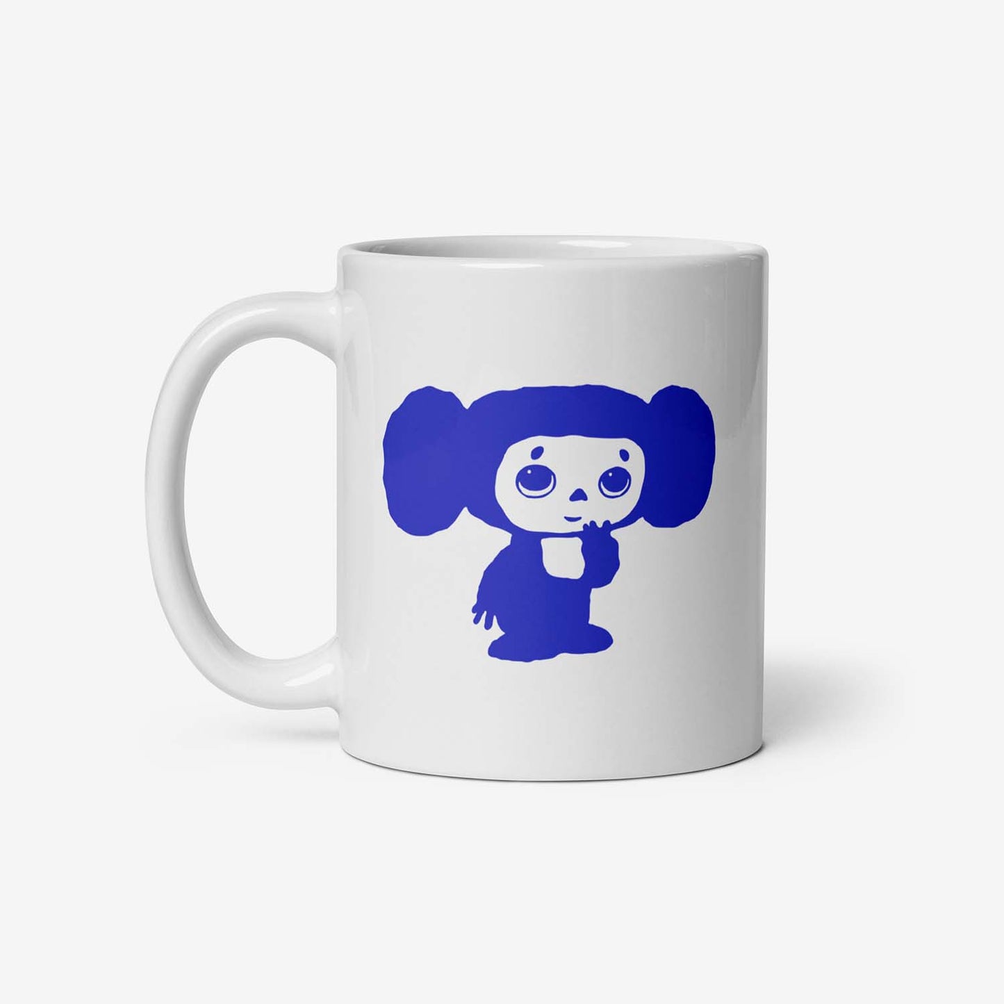 Ceramic mug featuring a shy Cheburashka, inspired by the classic Soviet cartoon, a nostalgic USSR collectible.