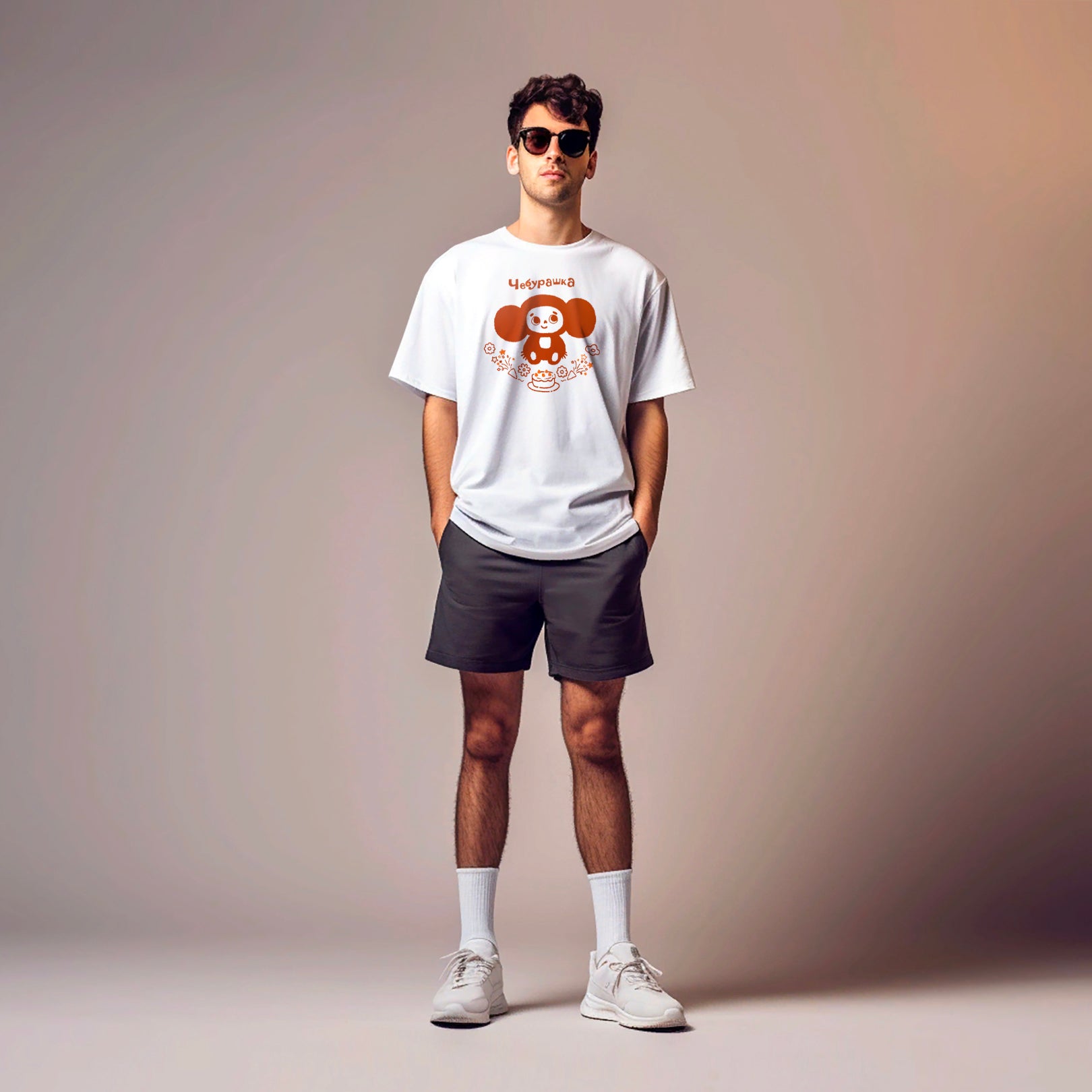 Boy wearing white unisex t-shirt with Cheburashka with birthday cake printed in brown colors