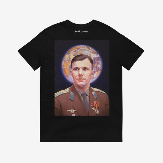 Black unisex T-shirt with large painting of Yuri Gagarin in medals, Earth halo behind head. Soviet space icon with Orthodox inspiration. www.artsoviet.com