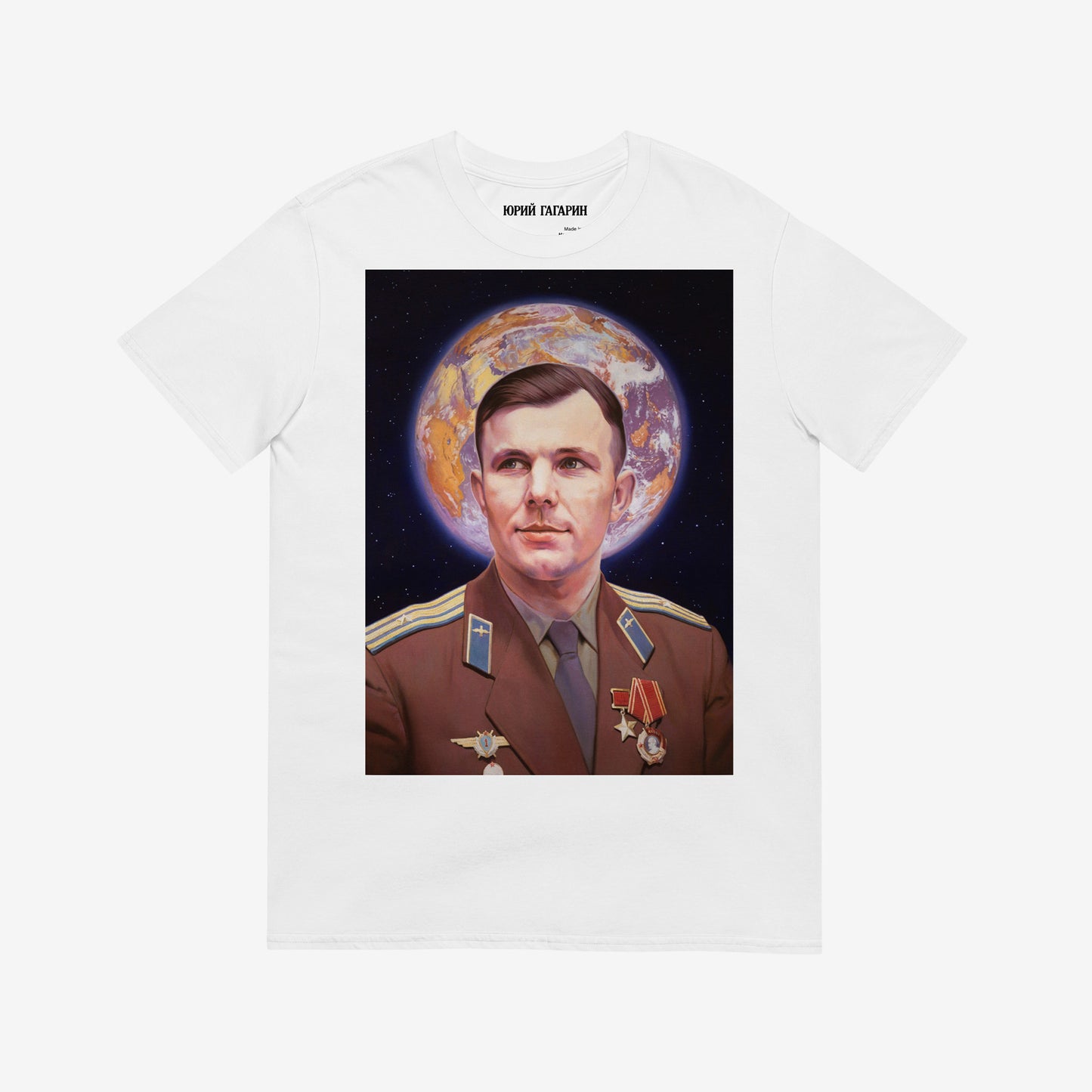 White unisex  T-shirt with large painting of Yuri Gagarin in medals, Earth halo behind head. Soviet space icon with Orthodox inspiration. www.artsoviet.com