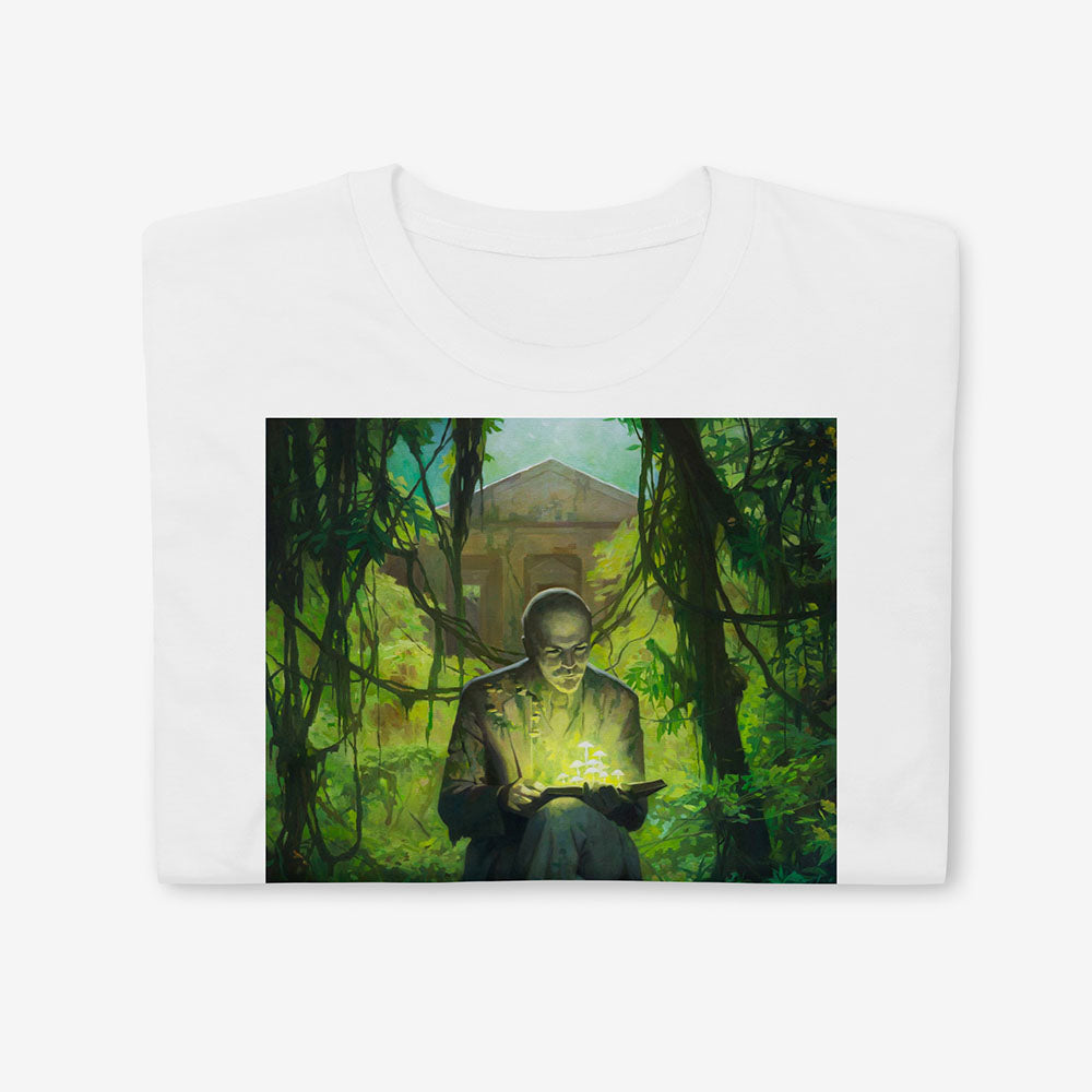 T-shirt with surreal image of Lenin statue in forest reading a book with glowing green mushrooms growing from it and on him