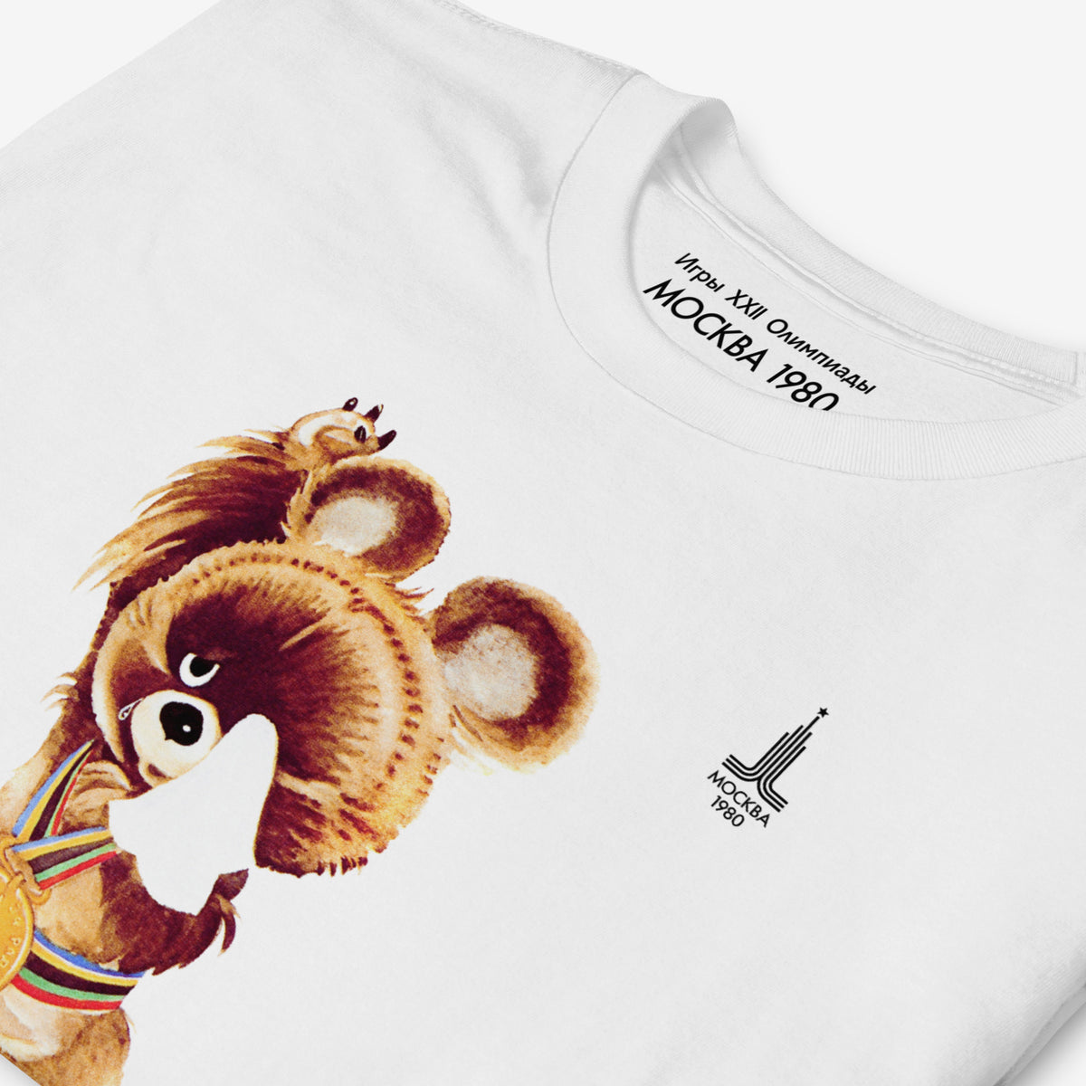 Original Soviet Moscow 1980 bear mascot Misha crying at the Closing ceremony white unisex T-Shirt. Necktag and print closeup