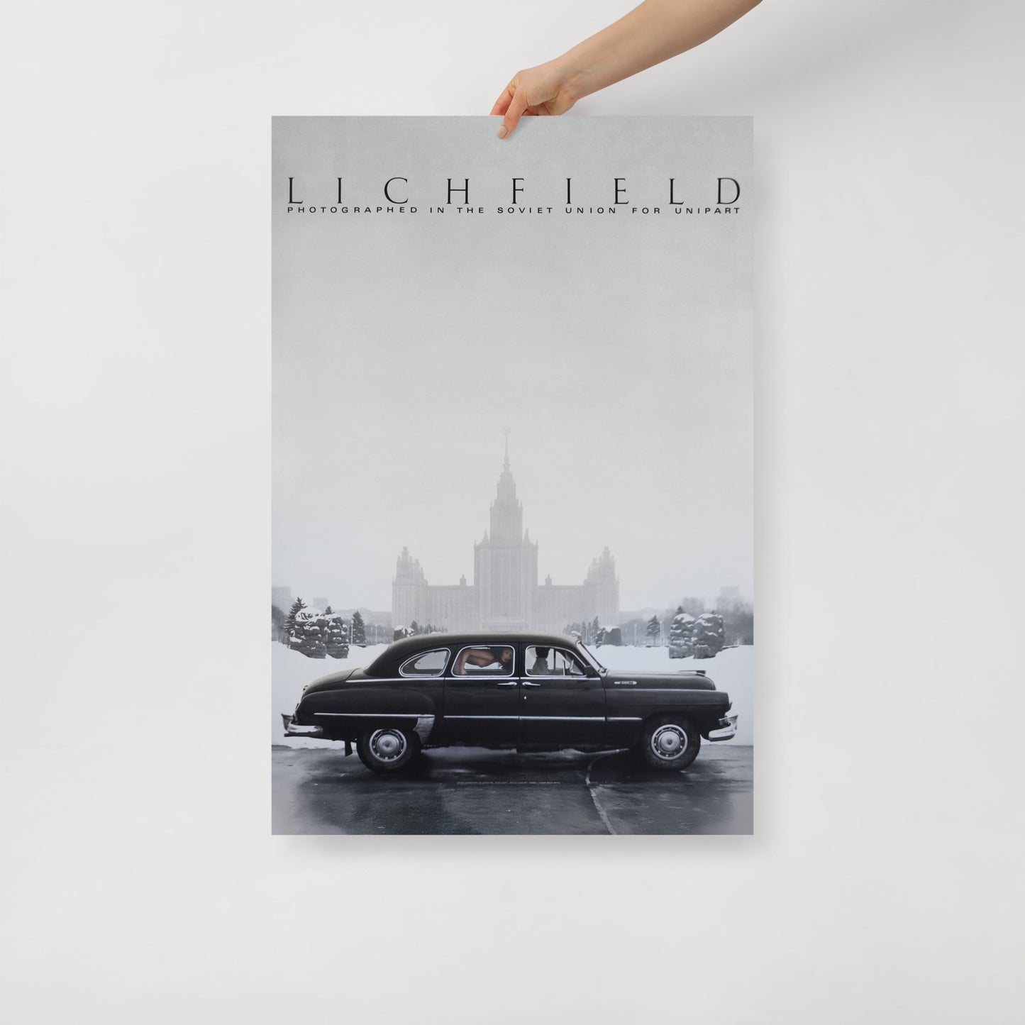 Late Soviet Moscow photo poster with Chaika car, nude woman inside, and Stalinist skyscraper in background – with cinematic tone.