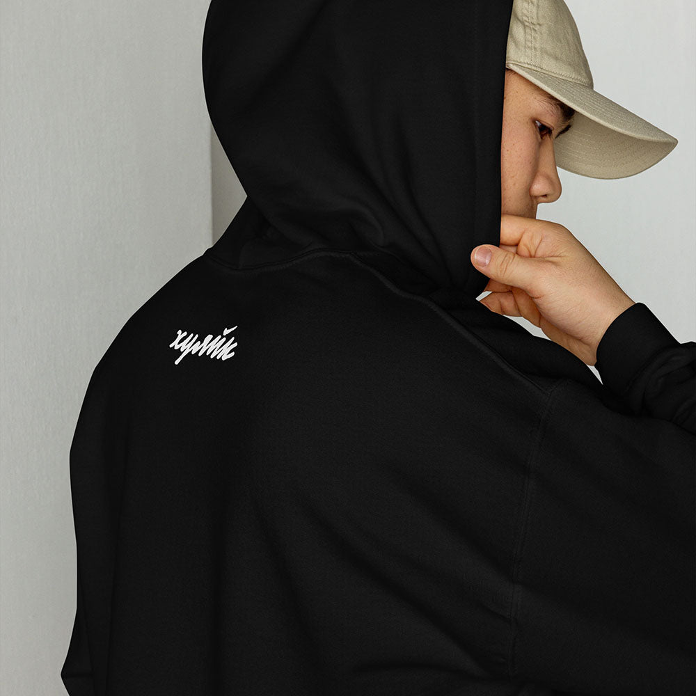 Funny Russian ХУЯЙК parody logo design in bold Cyrillic lettering on premium unisex hoodie – a play on Nike with Russian Gopnik slang twist, perfect for expats and streetwear lovers