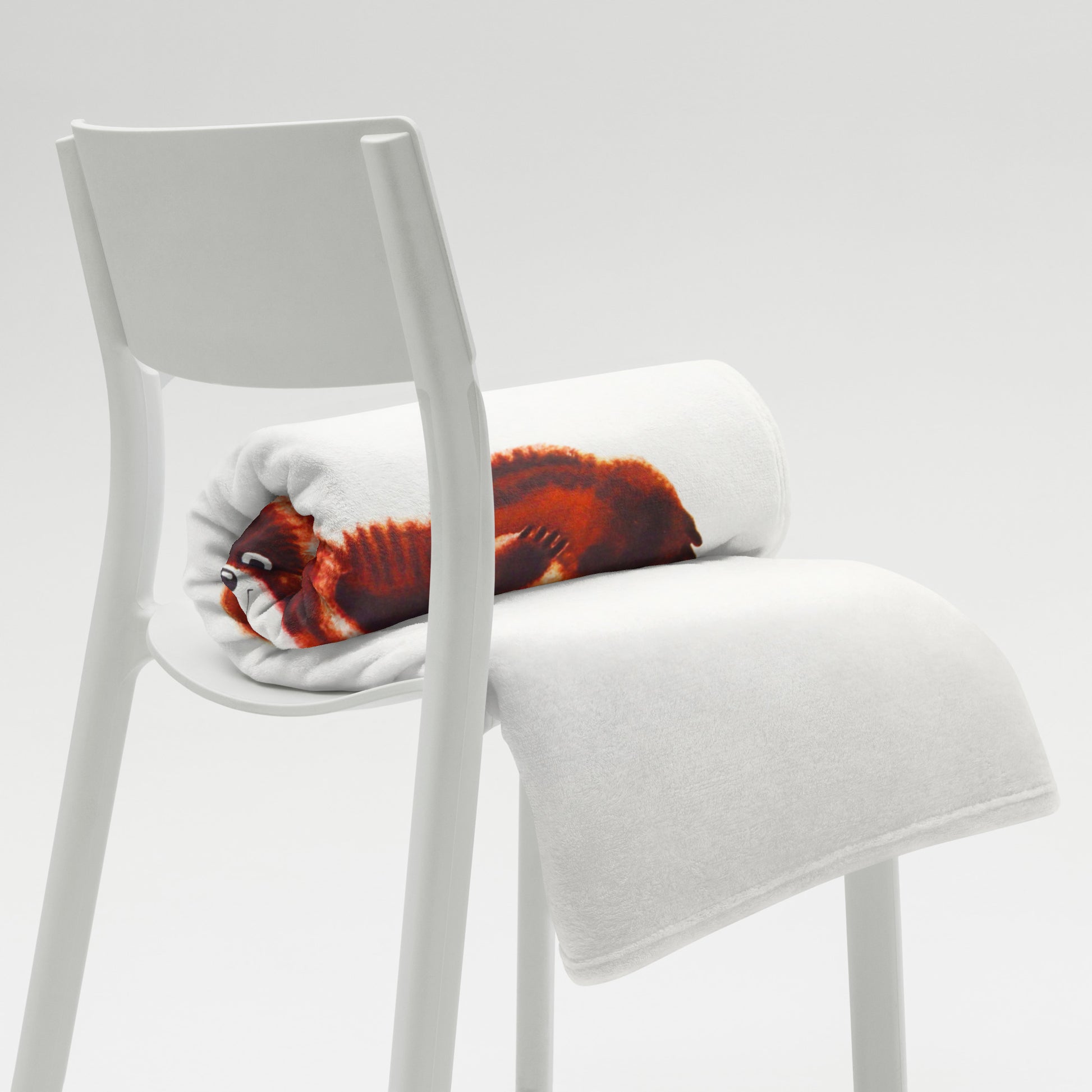 Large white blanket with Soviet Olympic Bear Misha and Moscow 1980 Olympic Games logo - folded on the chair