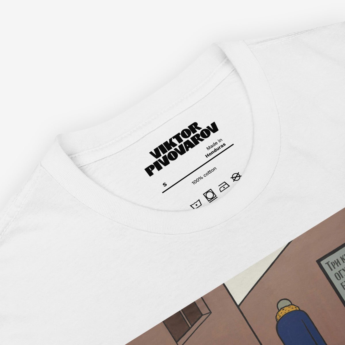 White unisex T-shirt featuring Viktor Pivovarov’s Soviet conceptual artwork ‘A bun for tea’. Closeup