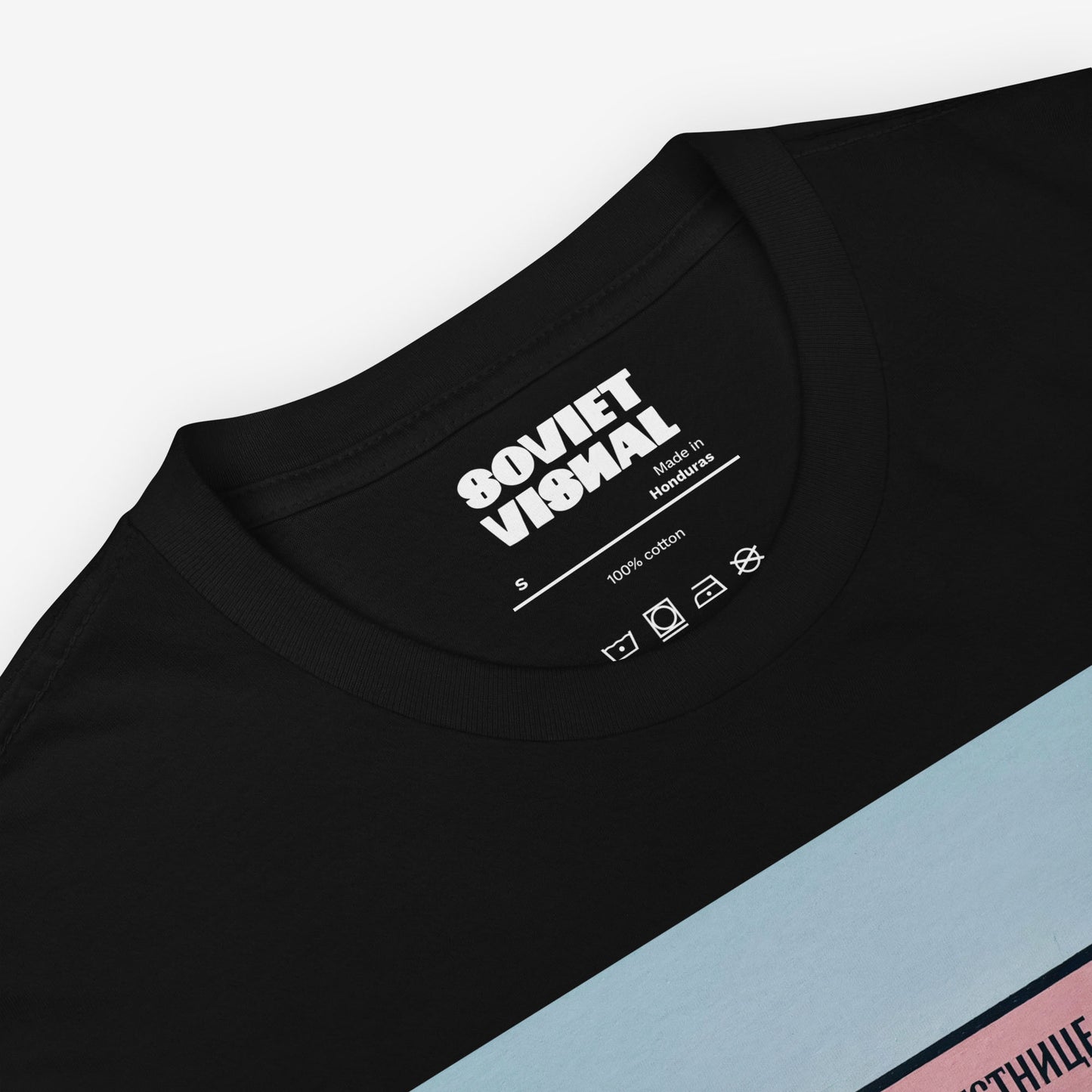 Inside tag closeup view of the unisex black T-shirt showcasing the large Soviet print
