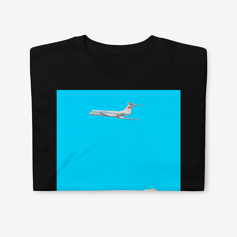 Unisex T-shirt featuring dreamy Soviet blonde boy watching Aeroflot plane with red USSR flag on tail in sky, Olympic logo on back of boy's shirt