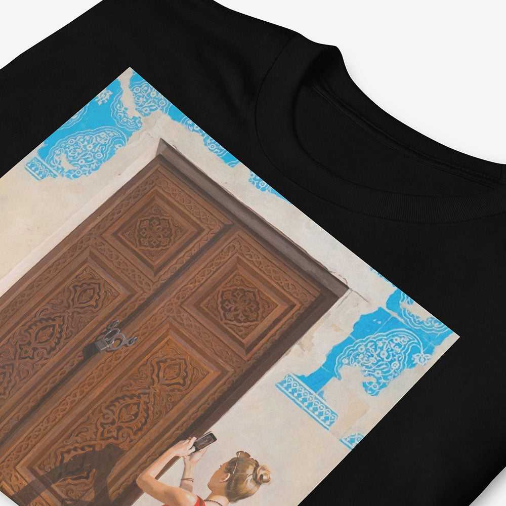 Unisex T-shirt with Russian girl photographing Uzbek door and boy reading map beside historic blue-tiled building in Bukhara