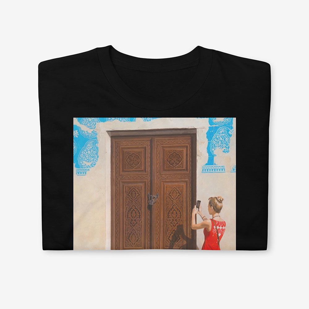 Unisex T-shirt with Russian girl photographing Uzbek door and boy reading map beside historic blue-tiled building in Bukhara