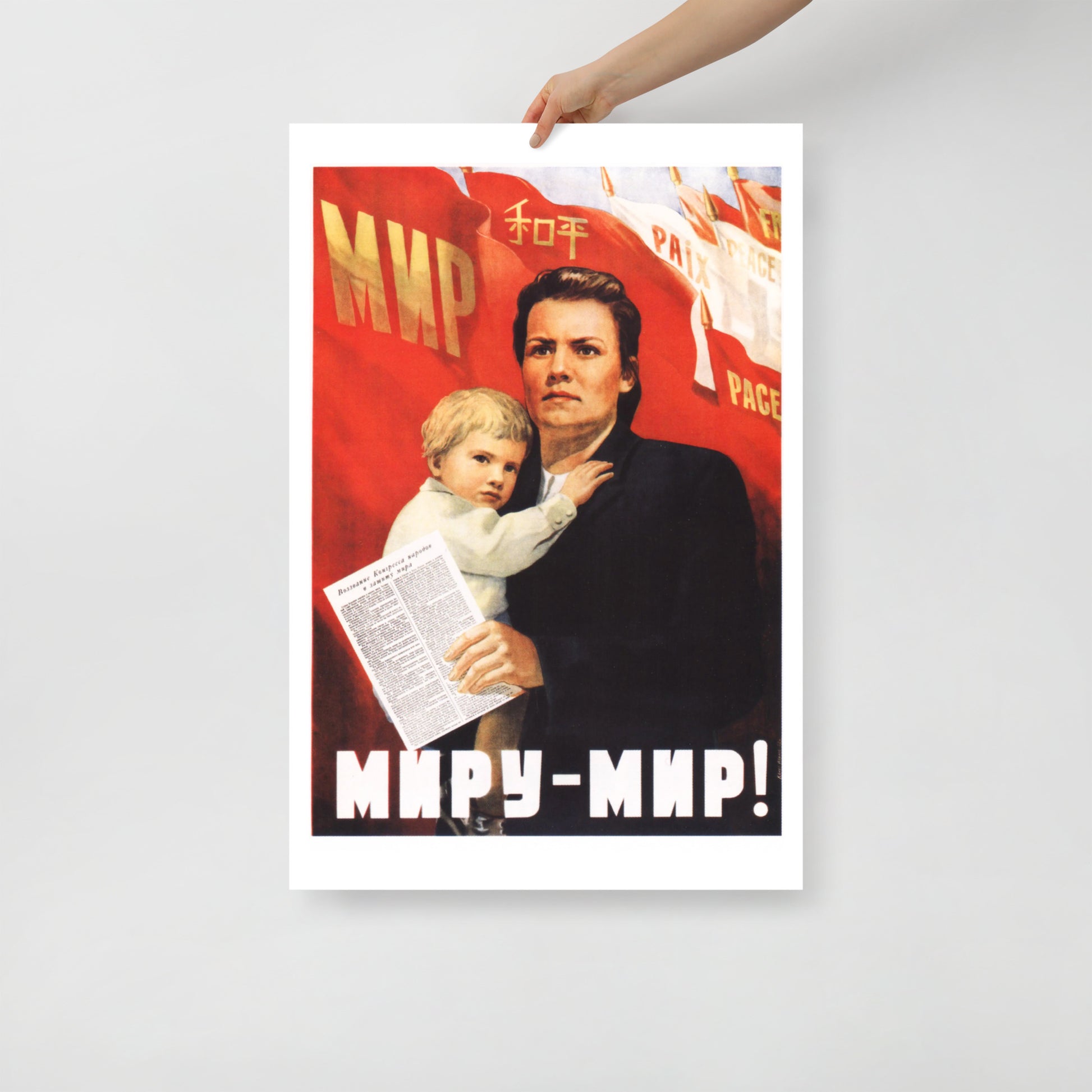 Front view of the large Soviet poster showcasing the woman, baby, and multilingual “Peace” flag, shot in a minimalist setting with natural lighting