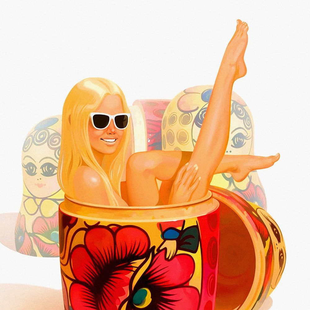 Large poster with a playful modern blonde girl wearing sunglasses lounging in a traditional Russian matryoshka doll with floral pattern, surrounded by other nesting dolls – pop art style