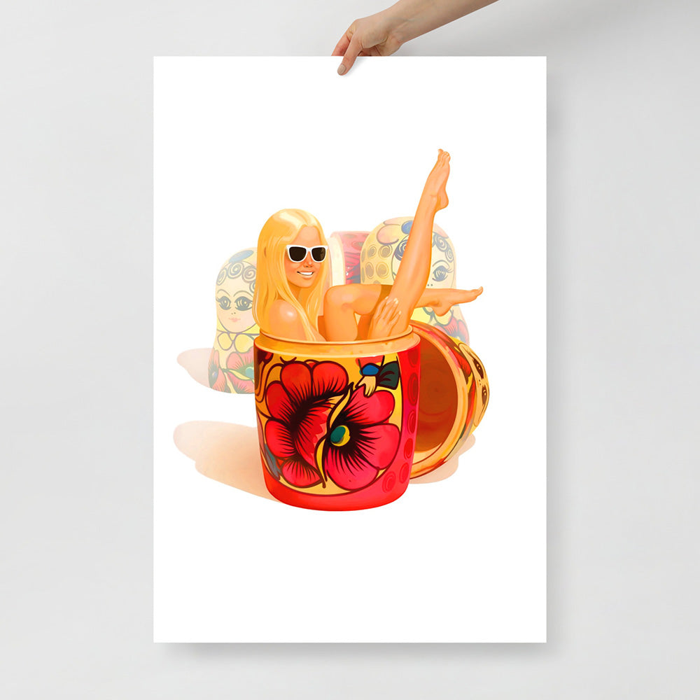 Large poster with a playful modern blonde girl wearing sunglasses lounging in a traditional Russian matryoshka doll with floral pattern, surrounded by other nesting dolls – pop art style