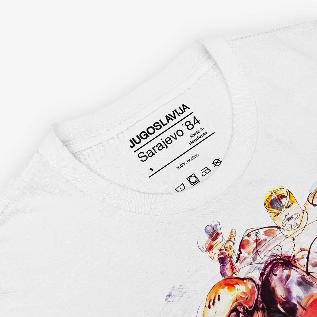 White unisex T-shirt featuring large artwork of Sarajevo 1984 Yugoslavian Winter Olympics Hockey artwork by Ismar Mujezinovic. Necktag