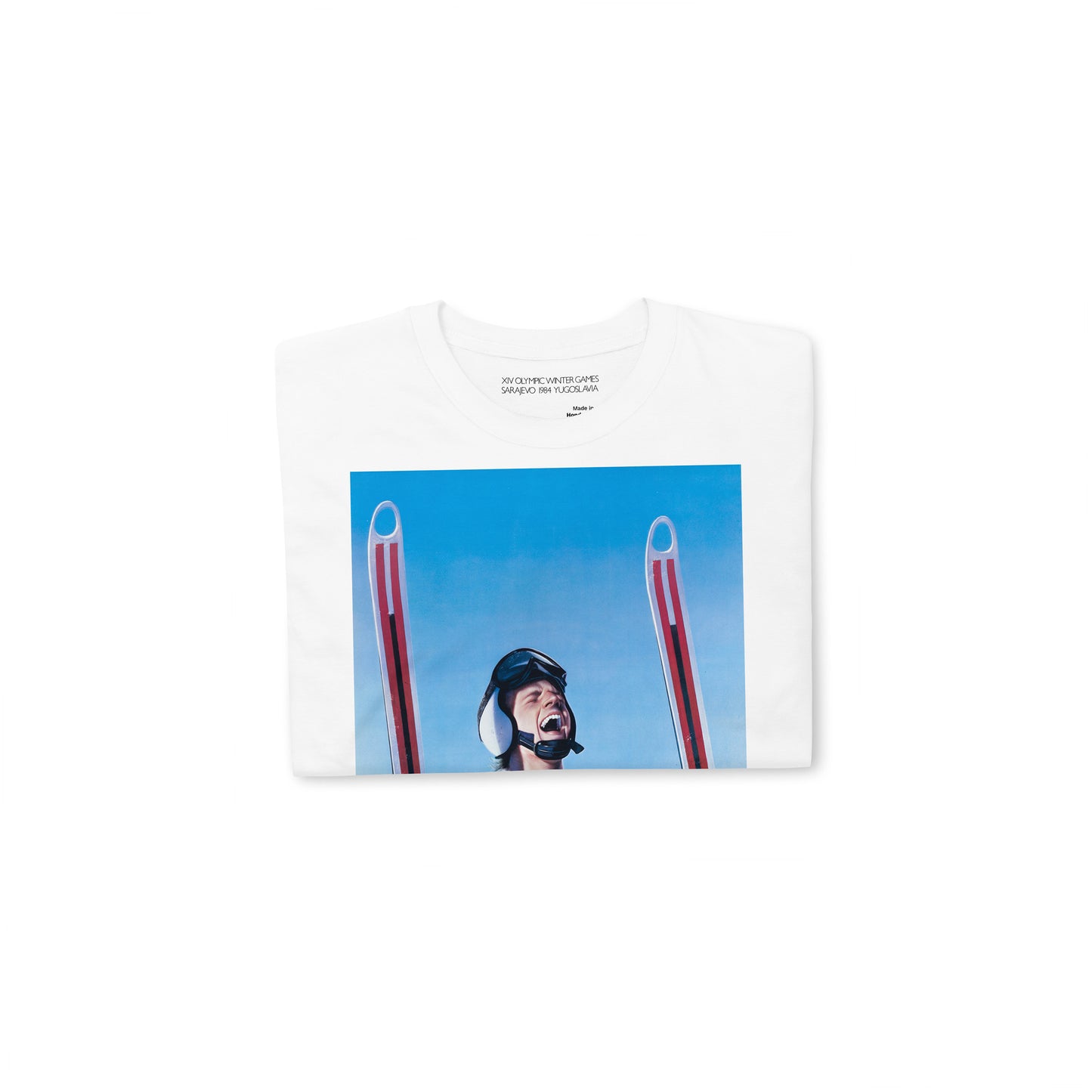 Yugoslavia Olympic Games white unisex T-shirt featuring large print of Sarajevo 1984 Winter Olympics skier. Folded. www.artsoviet.com