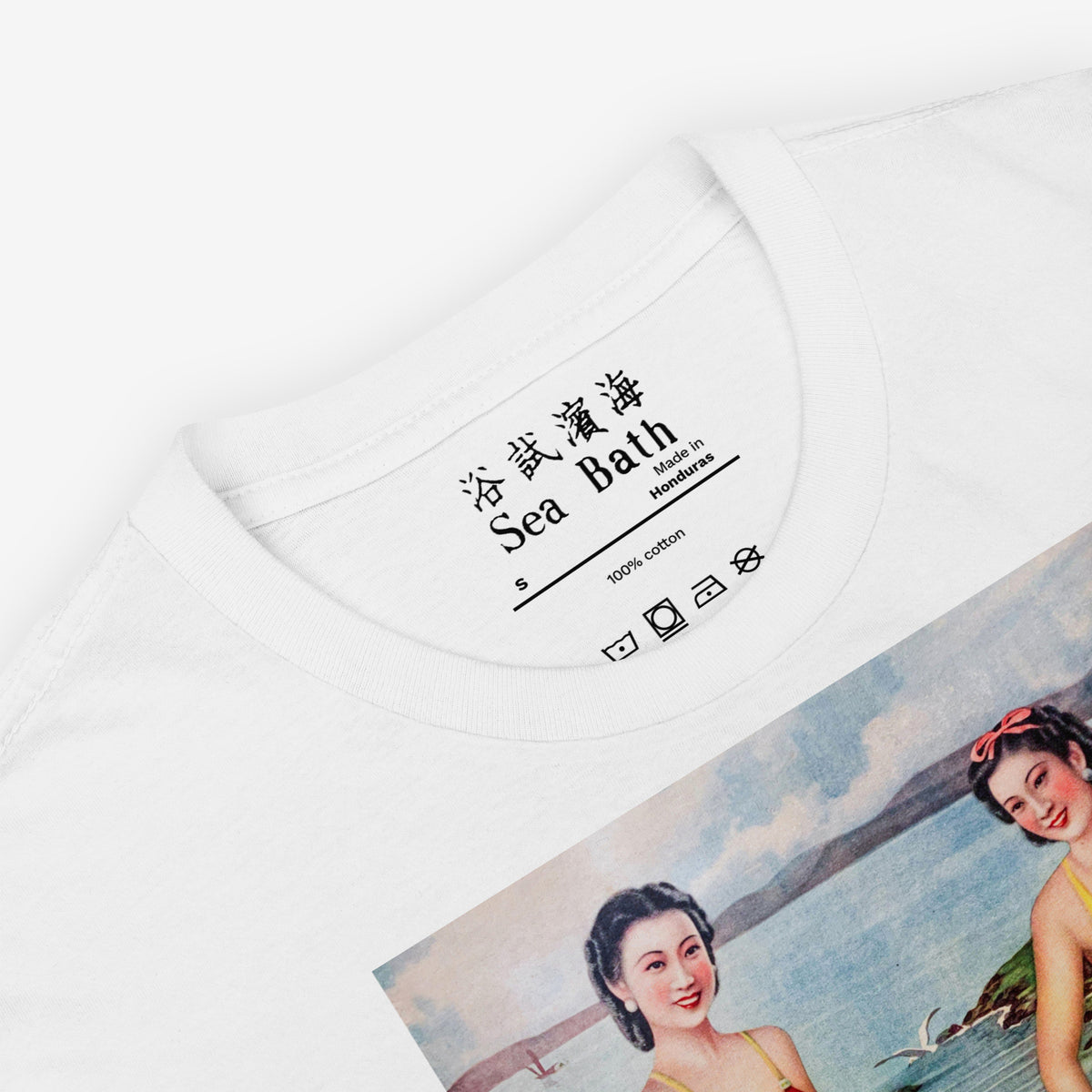 Vintage Soviet Chinese 1940s Shanghai Sea Bath white unisex Tee featuring large print with two ladies in swim suits swimming with a girl child. Closeup