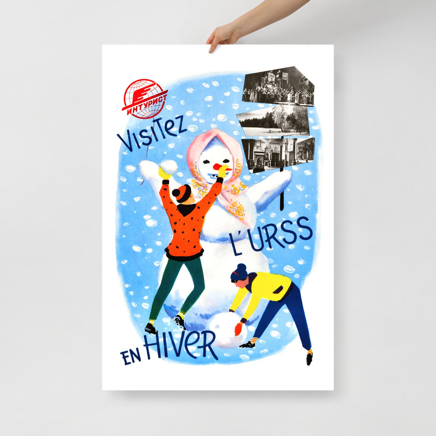 A hand holds large vintage 1958 Intourist Travel Poster Visit the USSR in Winter with a snowman. www.artsoviet.com