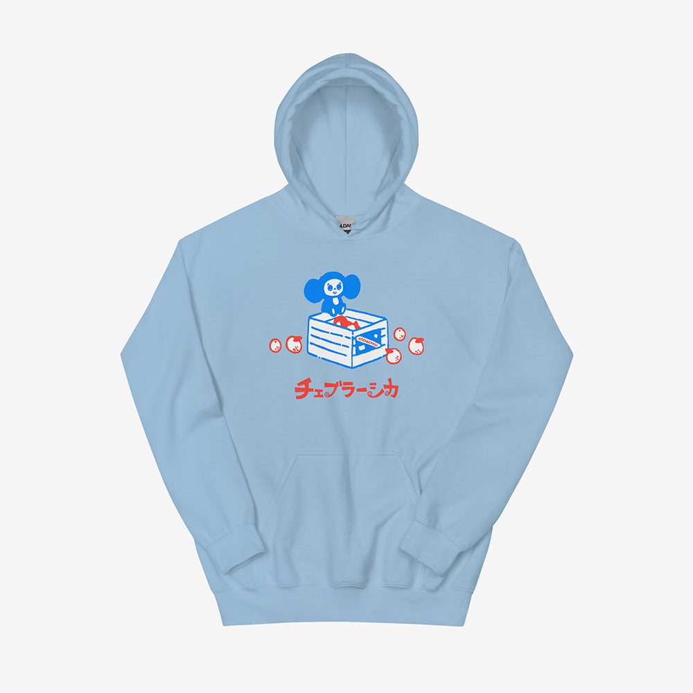 Unisex hoodie with a print of Soviet cartoon Cheburashka on a box of oranges with チェブラーシカ text in Japanese.