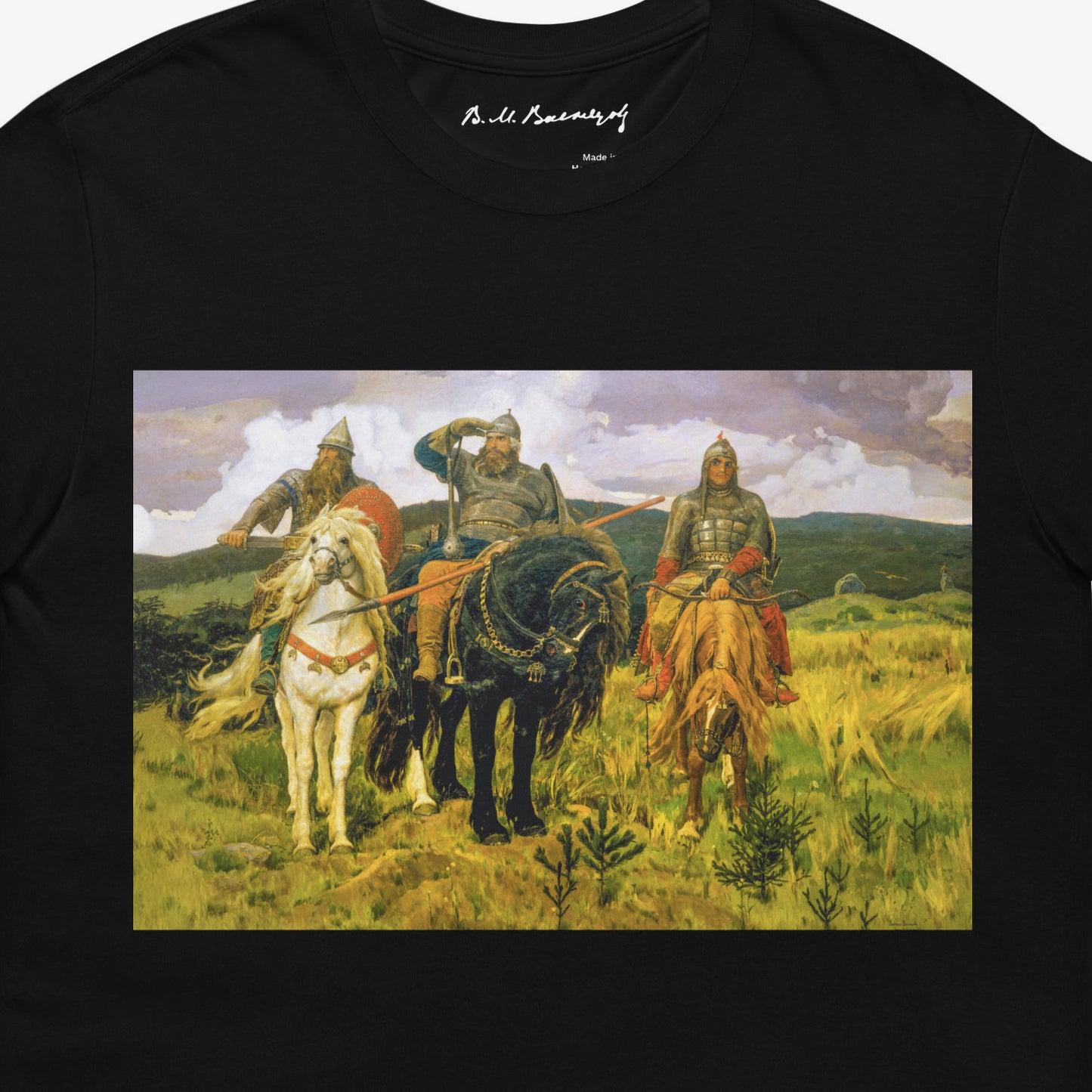 Black unisex T-shirt featuring large Viktor Vasnetsov Three Bogatyrs painting, depicting three legendary Russian warriors in a high-quality print. Closeup print details photo. Vasnetsov's signature seen on branded necktag. www.artsoviet.com