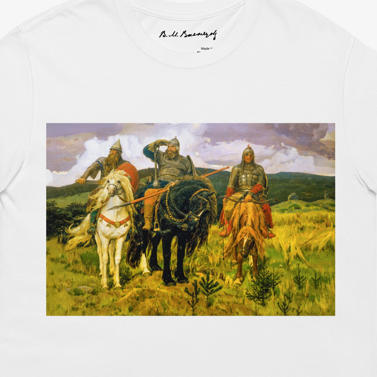 White unisex T-shirt featuring large Viktor Vasnetsov Three Bogatyrs painting, depicting three legendary Russian warriors in a high-quality print. Closeup print details photo. Vasnetsov's signature seen on branded necktag. www.artsoviet.com