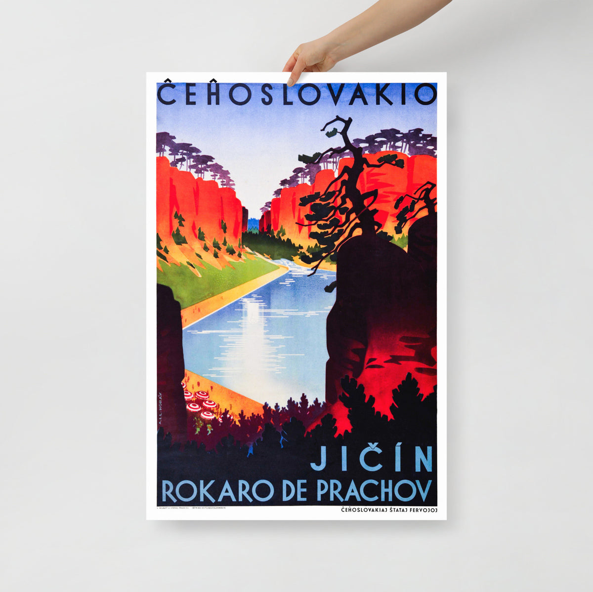 A hand holding 1930s Czechoslovakia travel poster by Ladislav Horak showing Prachov Rocks sandstone formations in Art Deco style. Large size 62x91cm.