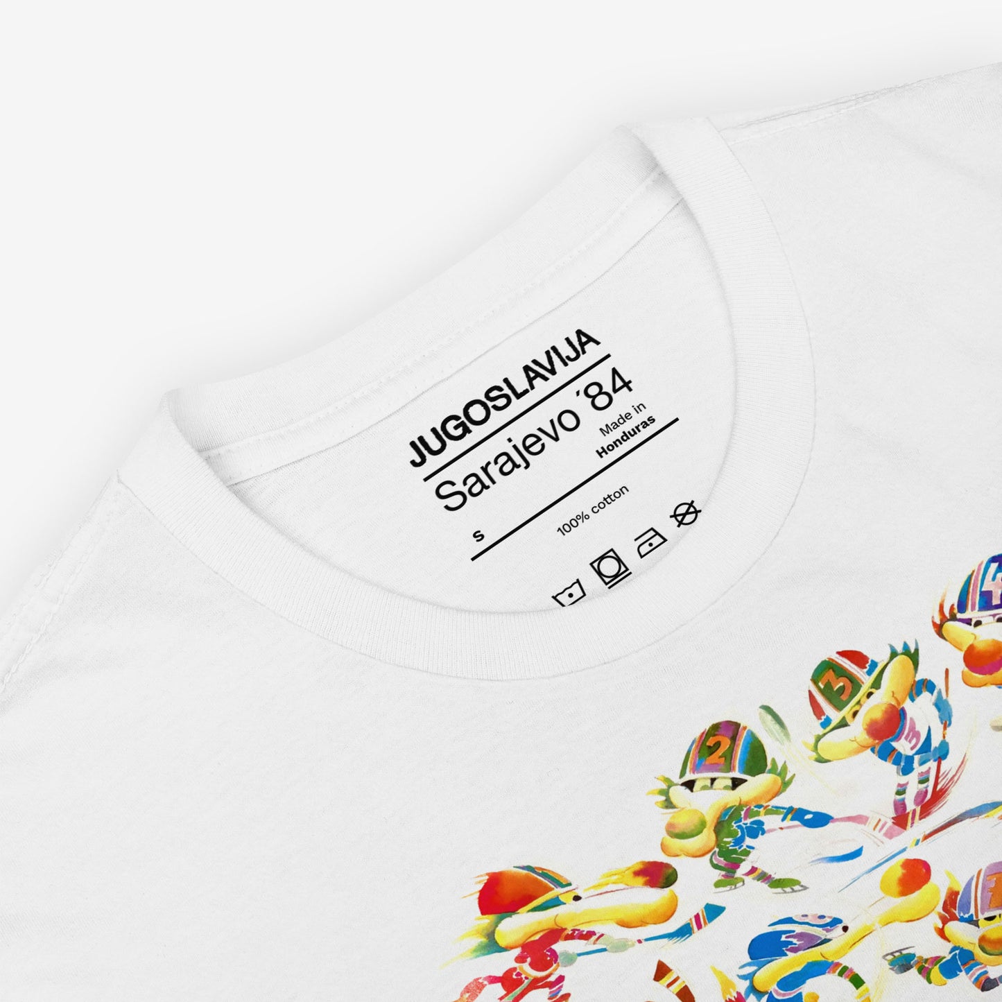 Unisex T-shirt featuring Vučko the wolf from Sarajevo 1984 Olympics – rare Yugoslav design in high quality. Closeup details with necktag design saying Sarajevo '84. www.artsoviet.com