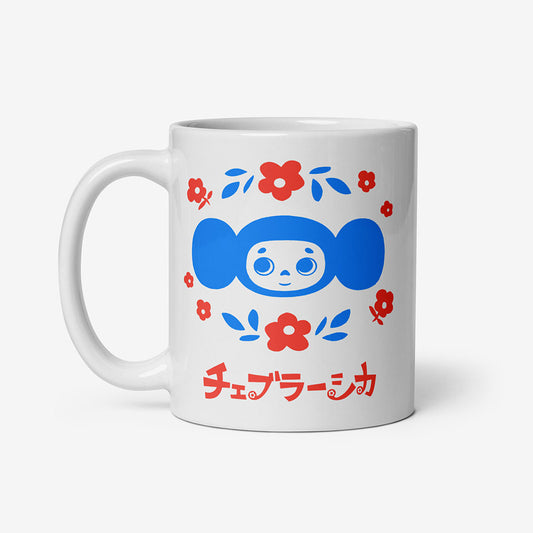 White coffee mug with Soviet vintage cartoon character Cheburashka with bouquet of flowers and Japanese チェブラーシカ logo in sky blue and light red