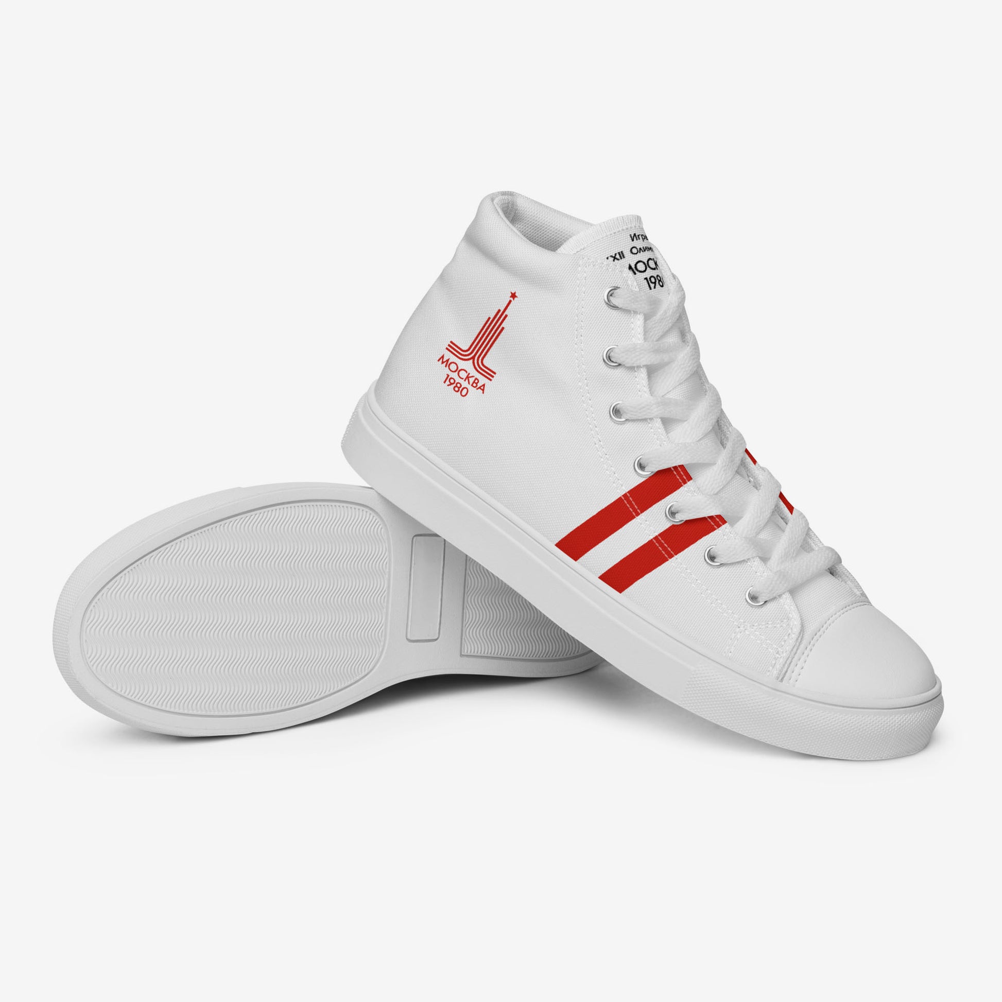 Womens Moscow 1980 Olympic Games high-top shoes with vintage navy graphics on white canvas, featuring the Olympic emblem and retro stripes.
