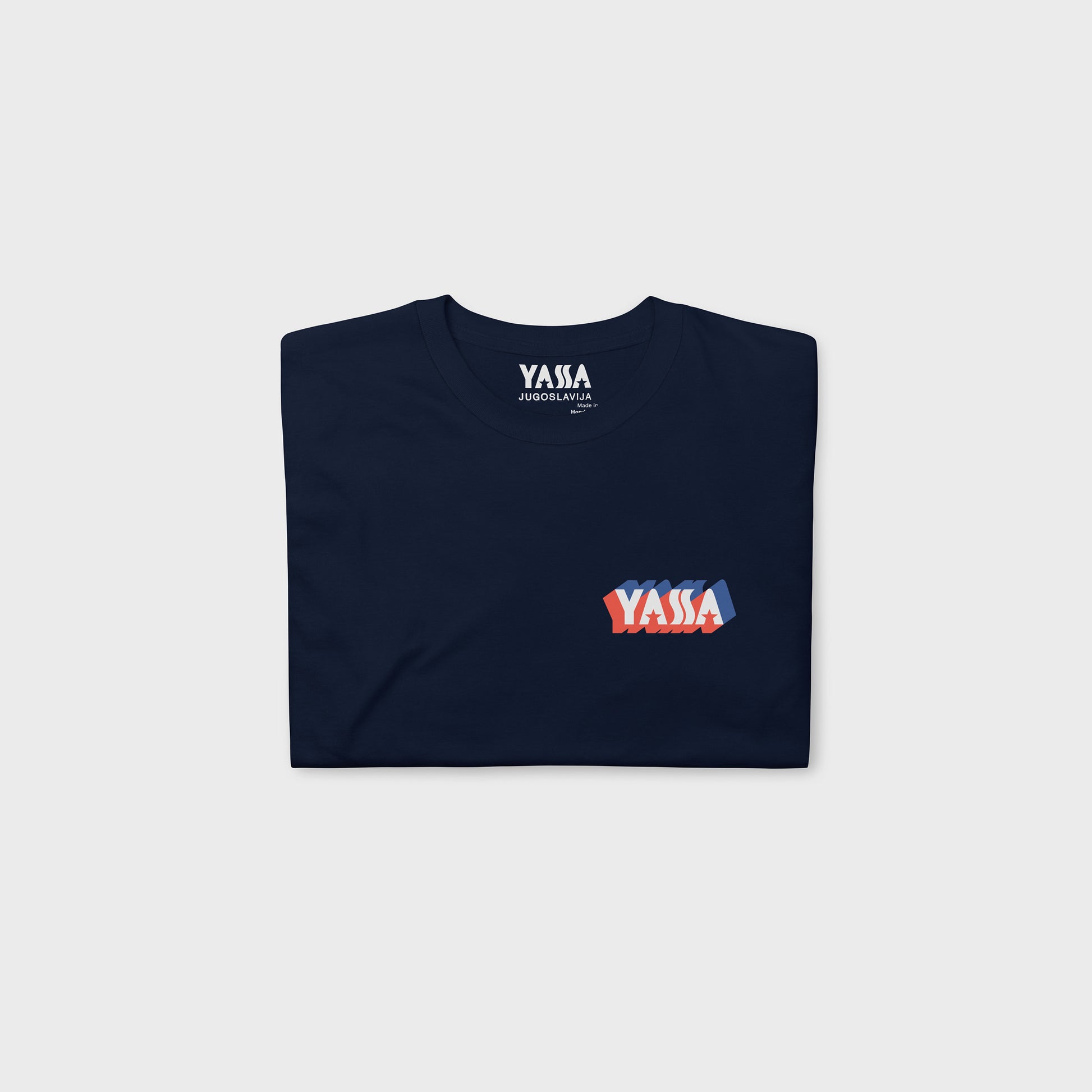 Navy blue unisex regular fit T-shirt featuring small YASSA logo on the front and large logo with wordmark JUGOSLAVIJA on the back. The iconic Yugoslavia sportswear brand. Folded. www.artsoviet.com