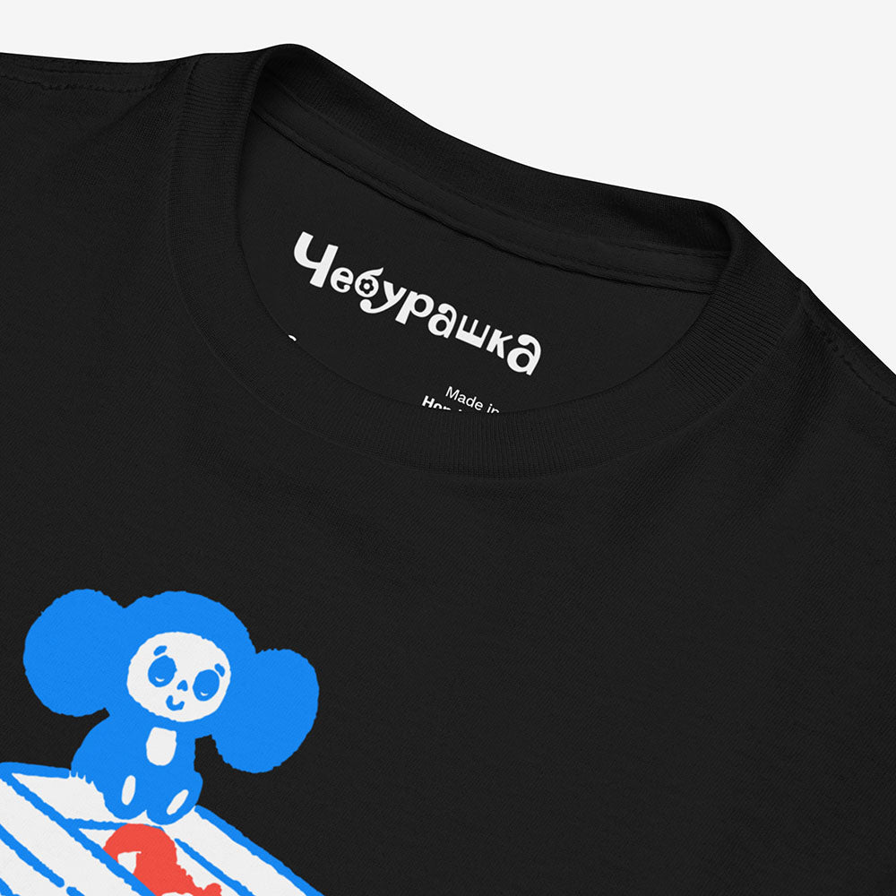 Youth Cheburashka T-shirt with cartoon print of Cheburashka on box of oranges with Japanese チェブラーシカ logo.