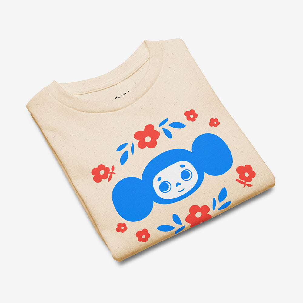 Youth T-shirt with Soviet cartoon character Cheburashka holding a bouquet of flowers, with チェブラーシカ text in Japanese, on a white background