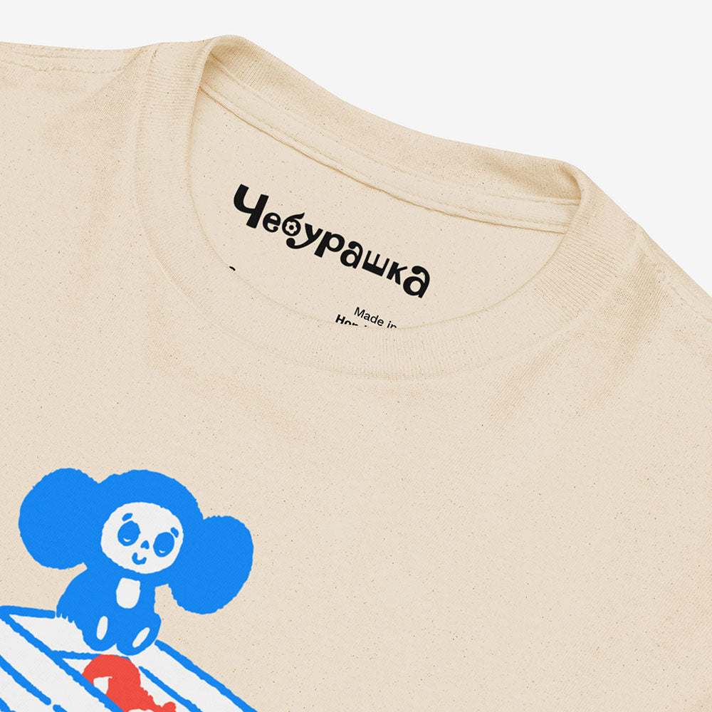 Youth Cheburashka T-shirt with cartoon print of Cheburashka on box of oranges with Japanese チェブラーシカ logo.