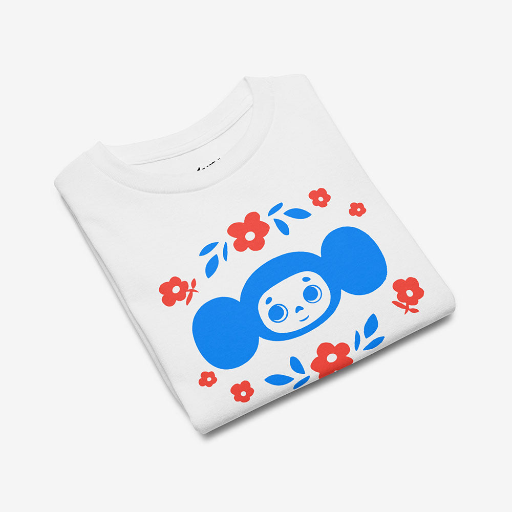 Youth T-shirt with Soviet cartoon character Cheburashka holding a bouquet of flowers, with チェブラーシカ text in Japanese, on a white background